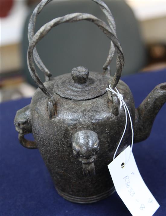 A Chinese iron temple teapot and cover, Qianlong mark and of the period, height 20cm with handles upward